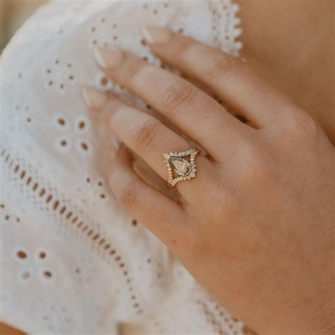 From a petite solitaire diamond nestled on a 14-karat solid gold beaded band to a chic take on the of-the-moment "toi et moi" style, the <b>ring</b> offerings are understated yet still nod to the. . Brooklyn and bailey engagement ring